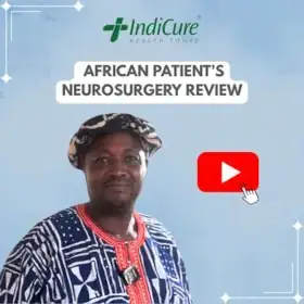 A headshot of an African man named Yves. The image promotes his neurosurgery review with IndiCure.